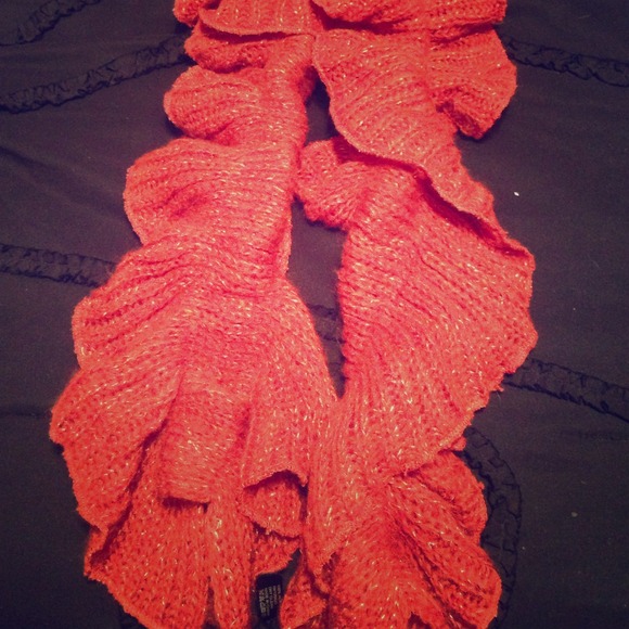 Orange scarf with gold thread sewn into it as well