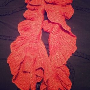 Orange scarf with gold thread sewn into it as well