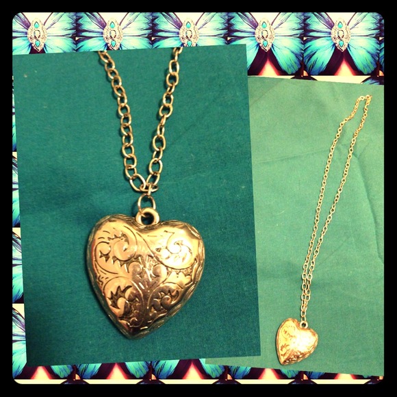 Heart shaped, long silver necklace.