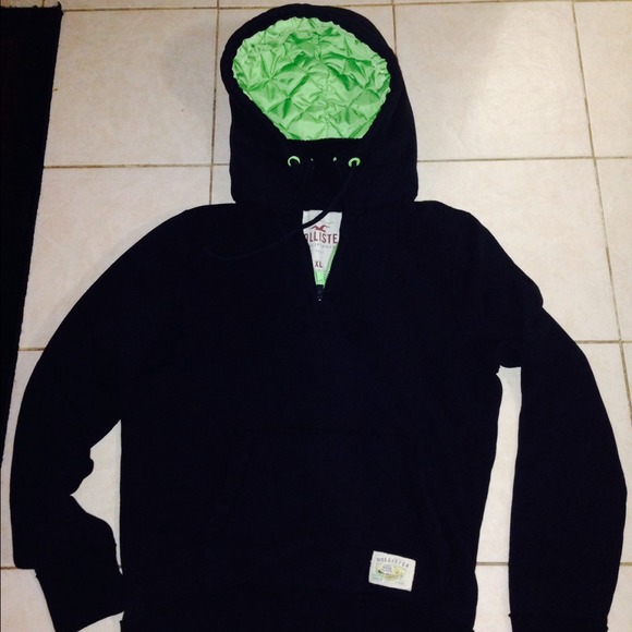 Dark blue and lime green sweater.
