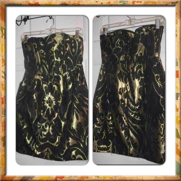 H&M BLACK AND GOLD DRESS WITH SIDE POCKETS.