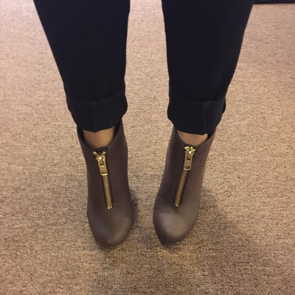 A pair of Michael Antonio zipper booties.