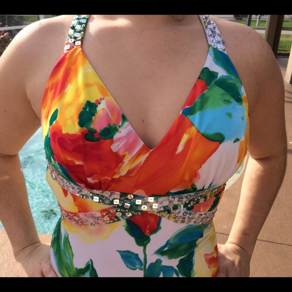 Floral open back beaded x-cross back gown.