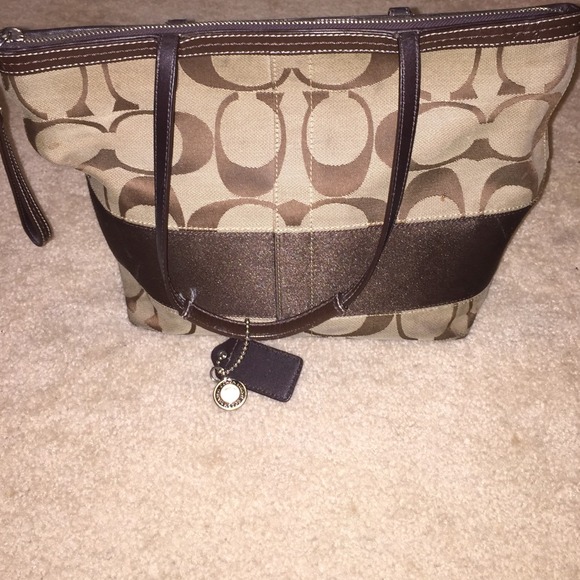 A brown coach bag