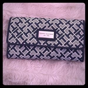 A blue and white Tommy Hilfiger wallet