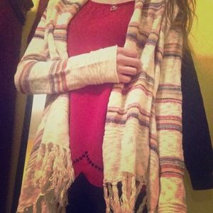 Women's knit open front fringe sweater.