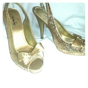 Gold glitter heels.