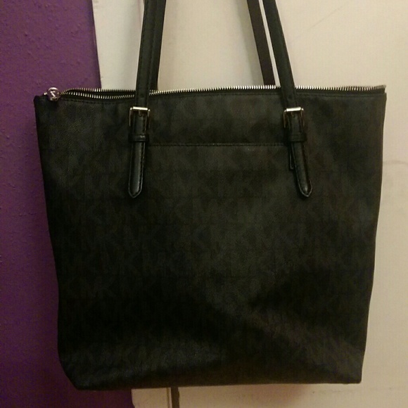 A Micheal Kors black tote reserved