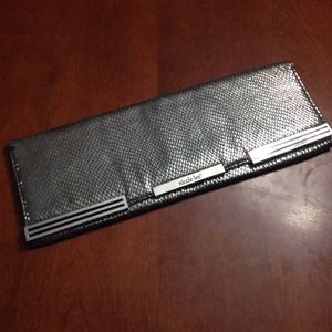 Embossed Nicole Lee silver clutch.