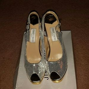 SOLD Silver slingbacks.