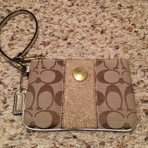 Tan and gold coach wristlet