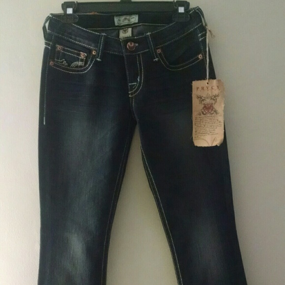 PRVCY blue faded wash jeans.