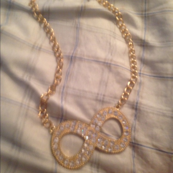 Gold stoned infinity sign