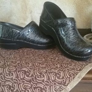 Black, silver clogs
