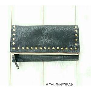 A Black Faux Leather Clutch with Gold Spikes