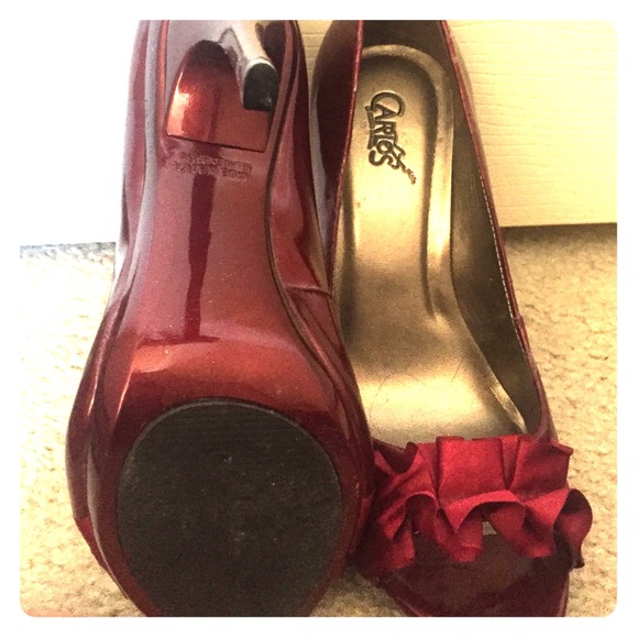 Carlos Santana oxblood peep toes.