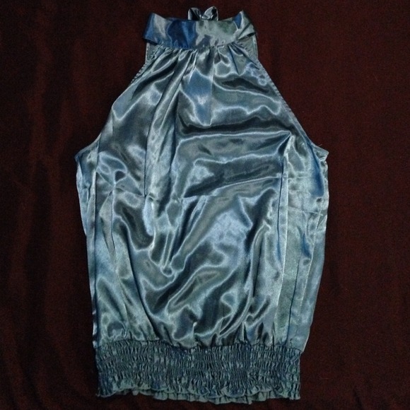 Teal dressy shirt ties around neck in the back