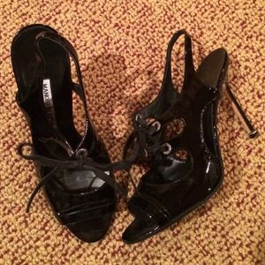 MANOLO BLAHNIK black patent heels.