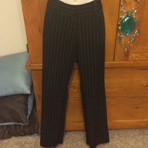 Black pants with white stripes.