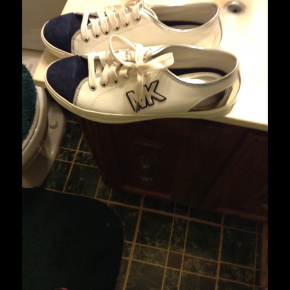 Brand new Michael Kors sneakers in the box.
