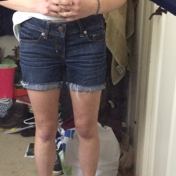 Dark wash midi shorts.