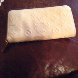 Cream color Louis Vuitton clutch wallet
