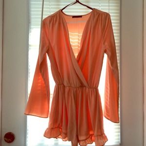 Peach colored long sleeved romper