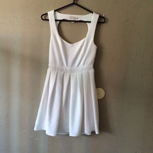 White dress with a heart shape at the back