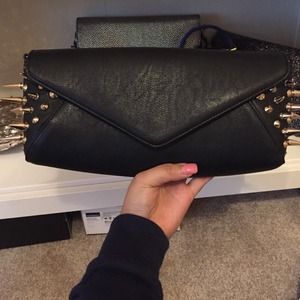 Black clutch with gold spikes