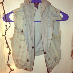 Light blue jean vest with buttons, zipper, & hood.