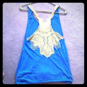 Free people chic top! With lace back