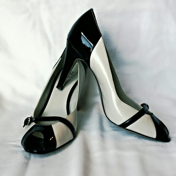 Black and white peep toe pumps
