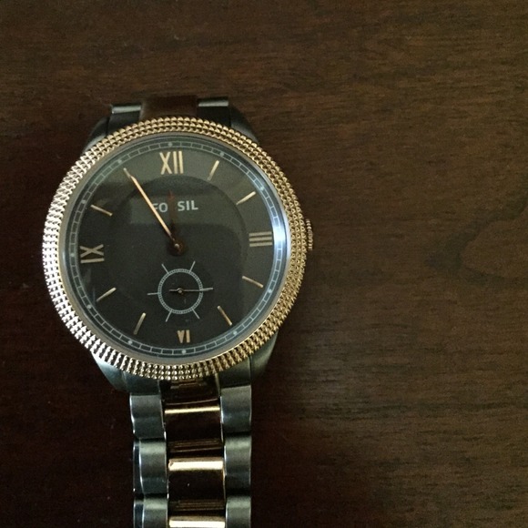 Fossil gray and brass color watch.
