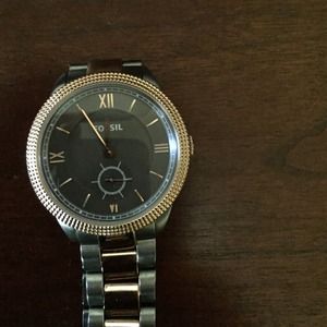 Fossil gray and brass color watch.