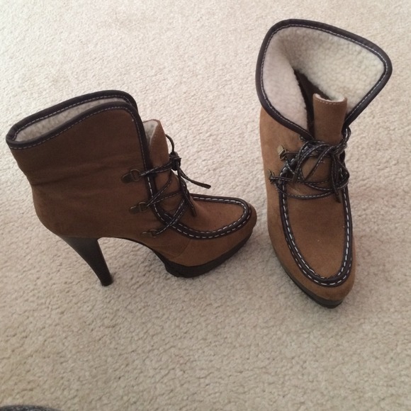 Brown high heel boots with track sole