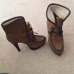 Brown high heel boots with track sole