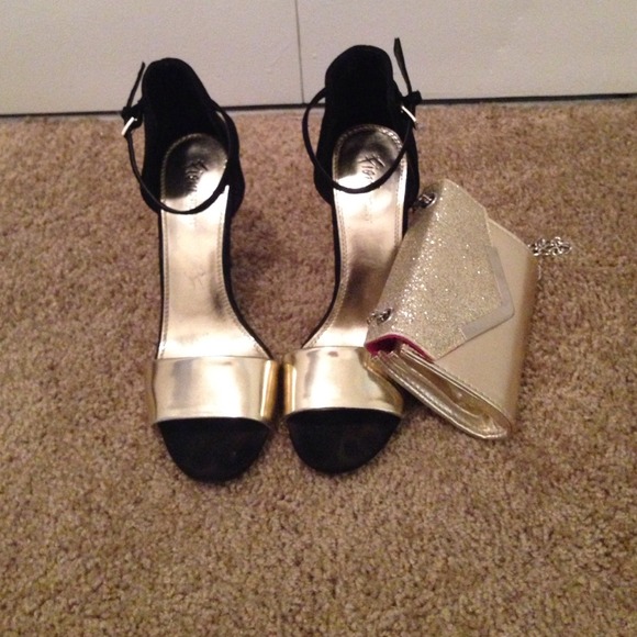 Black and gold open toe heels.