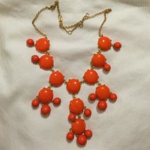 Orange bauble necklace.