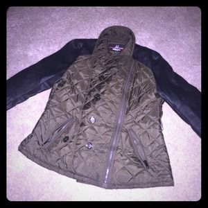 Green jacket with black leather sleeves