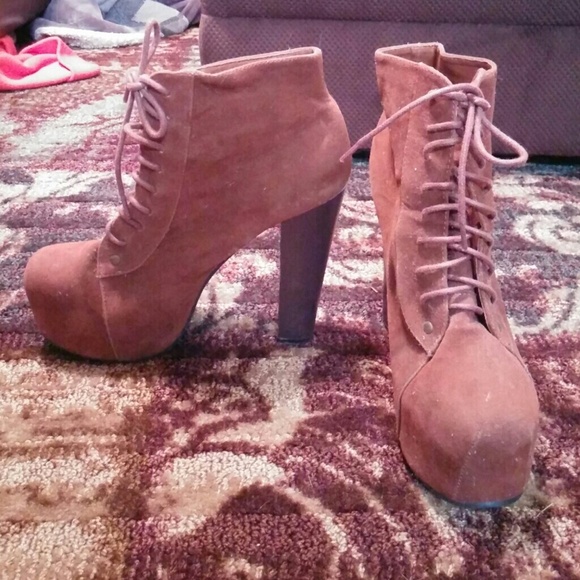Brown lace up high heeled booties