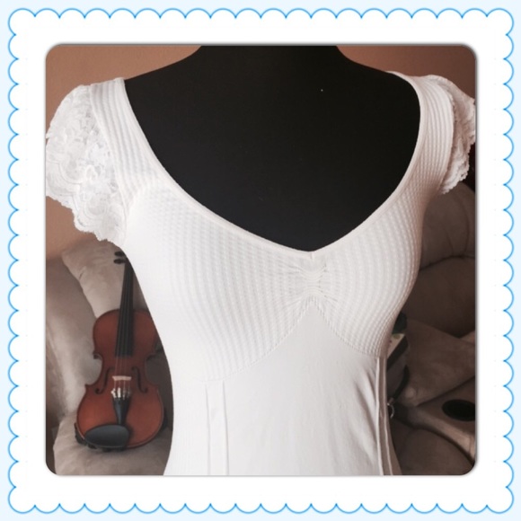 Bebe top with lacy sleeves.