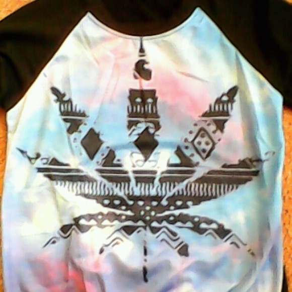 A sweater with a marijuana leaf.