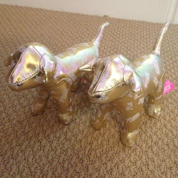 Two gold PINK dogs