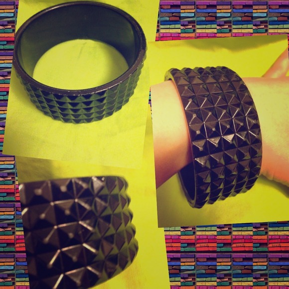 Black spike-like design bracelet.