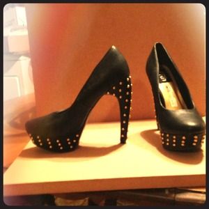 Black pumps with gold studs