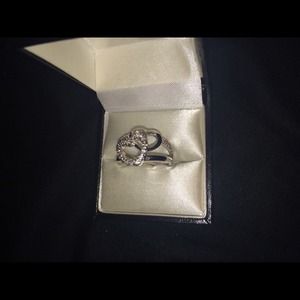 Silver ring with hearts.