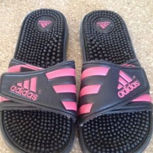 Adidas pink and black sandals.