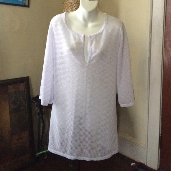 White 100% polyester shirt.