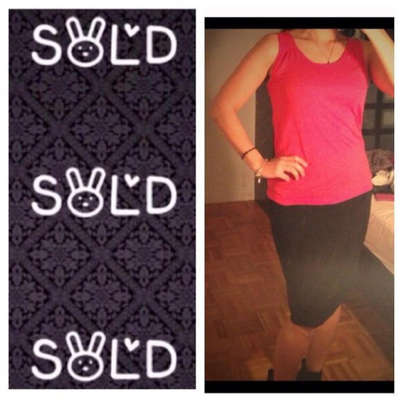 Beautiful pinkish red sleeveless top.