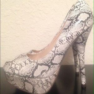 Breckelle's snakeskin patent platform heels